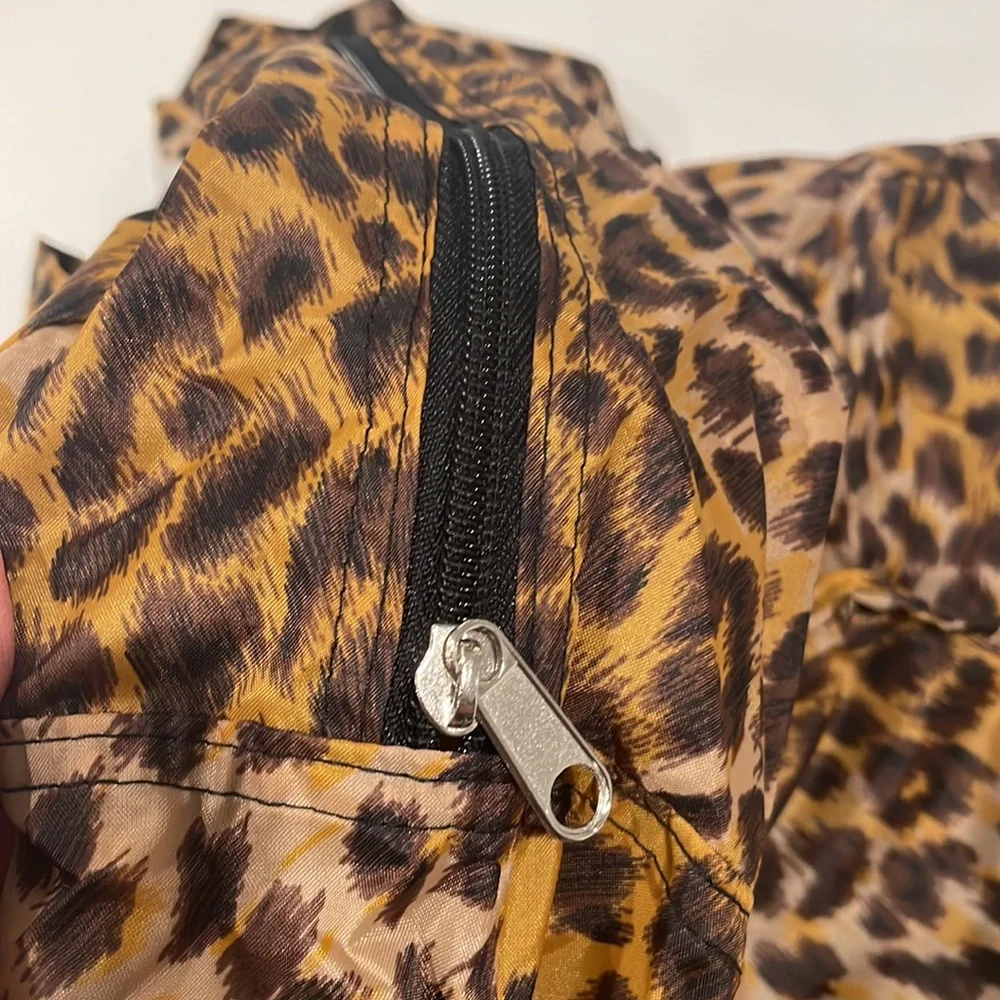 Nylon zipper tote with exterior zipper pocket. In Leopard. NWOT